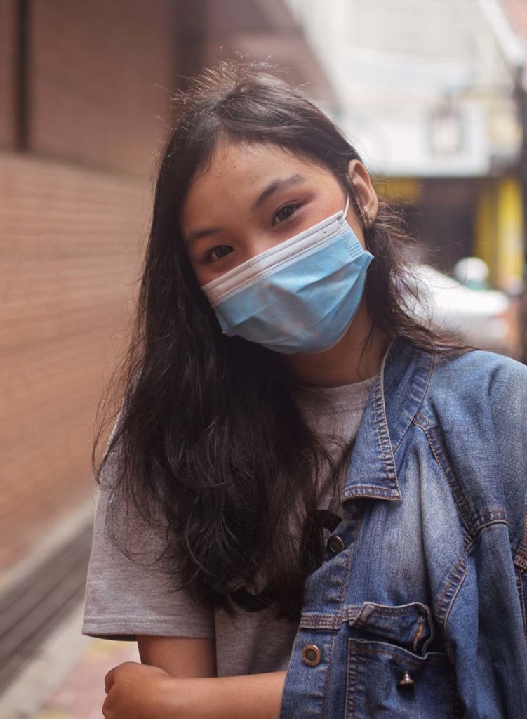 Female student with face mask. 
