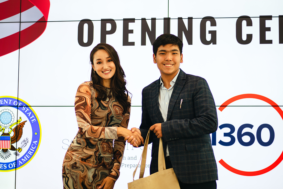 Alikhan Orynbay, SWU program student and Laura Vaigorova, CEO and co-founder of Smartestprep, during the Opening Ceremony.